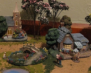See how the figures in this photo are almost small enough to go through the doorways of the buildings.  Click to see a bigger photo.