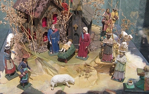 This mid-19th century Czech nativity is typical of hand-carved nativites from much of Europe. Note the townspeople in Czech dress in addition to the Bible characters.  Click for bigger photo.