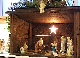 My parents' Nativity set was almost entirely dime-store plaster figures in a stable my Uncle Carl built for them when they were newly-weds. Click for bigger photo.